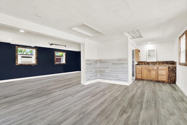 10375 106th Ter, Largo, FL 33773 - unfurnished living room featuring light wood-style flooring and recessed lighting