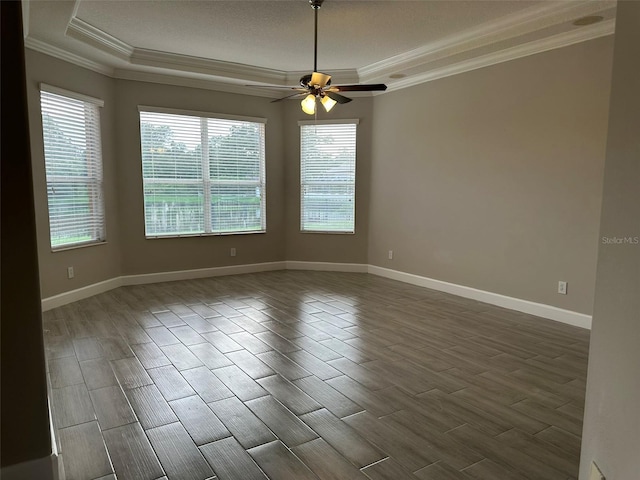 1008 Arista Blvd, Valrico, FL 33594 - unfurnished room with a tray ceiling, ornamental molding, wood tiled floors, and a ceiling fan