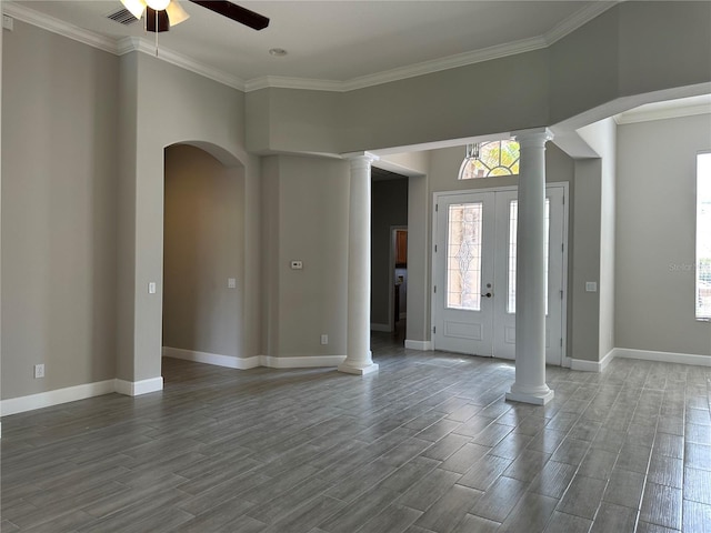 1008 Arista Blvd, Valrico, FL 33594 - entrance foyer featuring decorative columns, a ceiling fan, wood finished floors, plenty of natural light, and ornamental molding