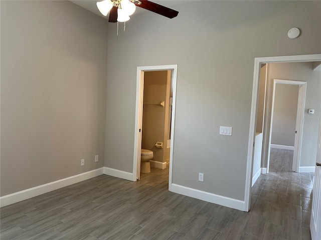 1008 Arista Blvd, Valrico, FL 33594 - unfurnished bedroom with dark wood-style floors, connected bathroom, and a high ceiling