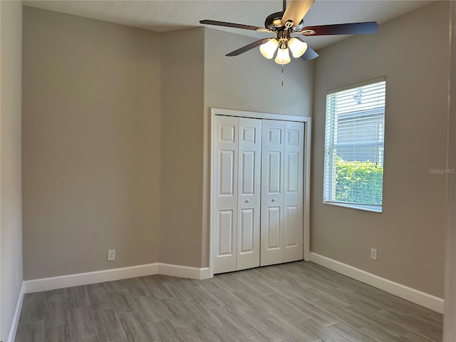 1008 Arista Blvd, Valrico, FL 33594 - unfurnished bedroom featuring light wood-style flooring, a closet, and a ceiling fan