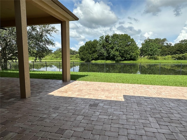 1008 Arista Blvd, Valrico, FL 33594 - fenced backyard featuring a patio area, a water view, and view of wooded area