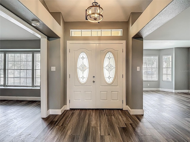 10206 Evening Trail Dr, Riverview, FL 33569 - entryway with dark wood-style flooring and a chandelier
