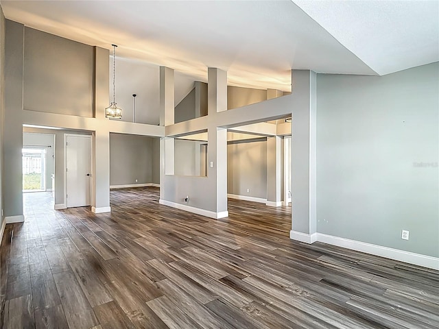 10206 Evening Trail Dr, Riverview, FL 33569 - empty room featuring dark wood-style flooring and high vaulted ceiling