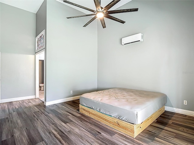 10206 Evening Trail Dr, Riverview, FL 33569 - bedroom featuring a wall unit AC and dark wood-style flooring