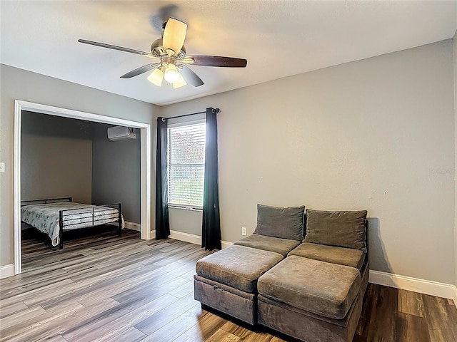 10206 Evening Trail Dr, Riverview, FL 33569 - sitting room with an AC wall unit, wood finished floors, and ceiling fan