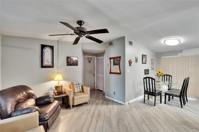 10549 112th Ave, Largo, FL 33773 - living area with light wood finished floors and a ceiling fan