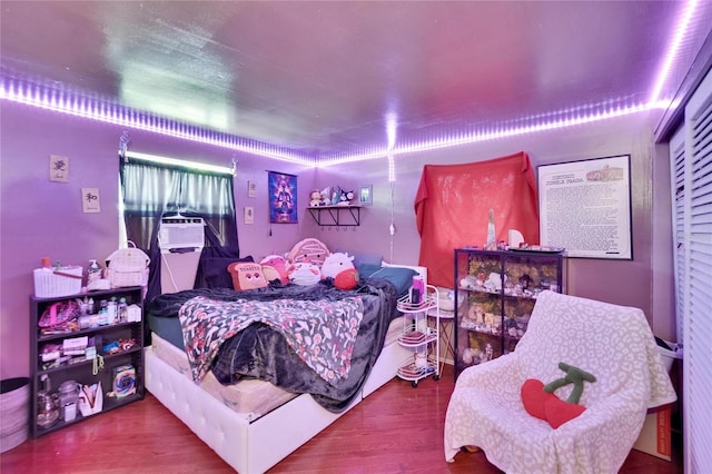 10549 112th Ave, Largo, FL 33773 - bedroom with wood finished floors and cooling unit