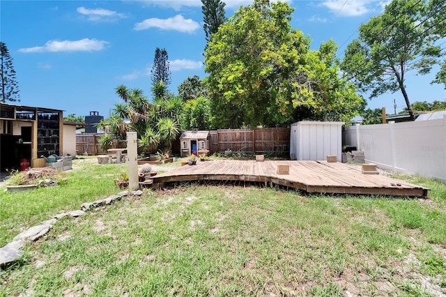 10549 112th Ave, Largo, FL 33773 - fenced backyard with a shed and a wooden deck