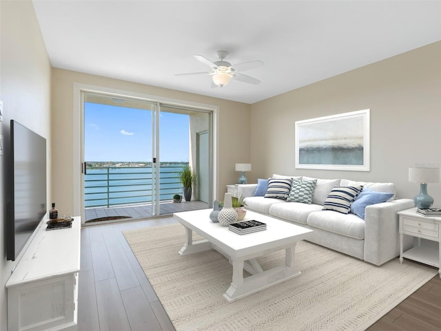 7979 Sailboat Key Blvd S Unit 505, South Pasadena, FL 33707 - living area with ceiling fan, a water view, and wood finished floors