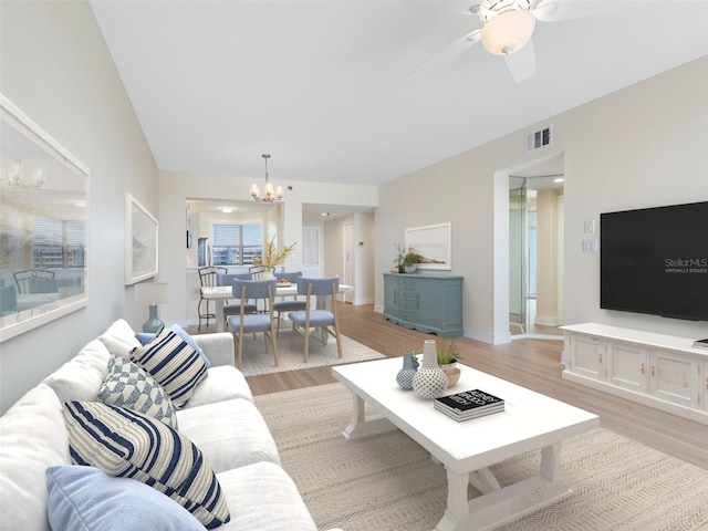 7979 Sailboat Key Blvd S Unit 505, South Pasadena, FL 33707 - living area with light wood finished floors, a chandelier, and a ceiling fan