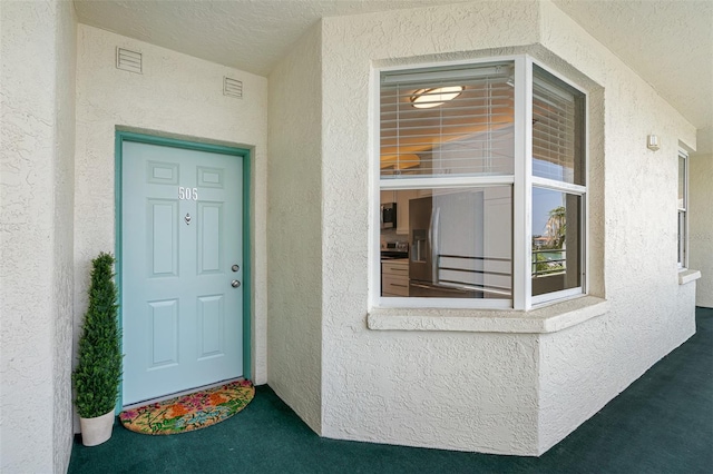 7979 Sailboat Key Blvd S Unit 505, South Pasadena, FL 33707 - doorway to property with stucco siding