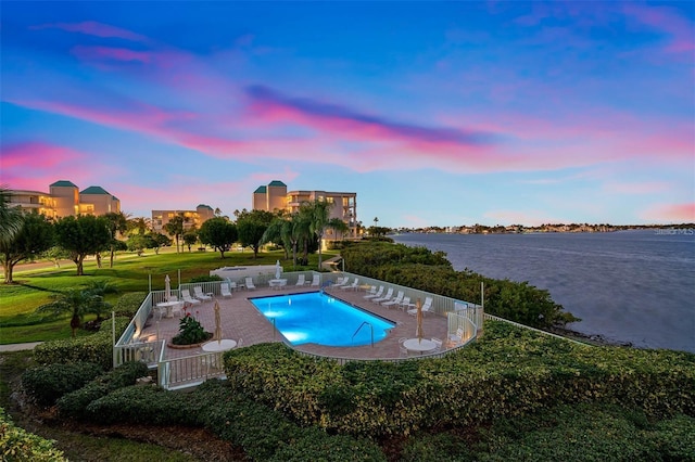 7979 Sailboat Key Blvd S Unit 505, South Pasadena, FL 33707 - pool at dusk with a water view, a patio area, and a community pool