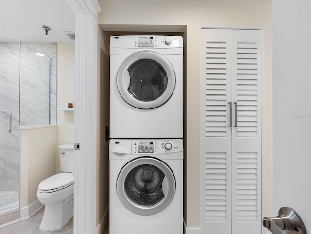 7979 Sailboat Key Blvd S Unit 505, South Pasadena, FL 33707 - washroom with estacked washer and dryer