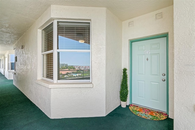 7979 Sailboat Key Blvd S Unit 505, South Pasadena, FL 33707 - doorway to property with stucco siding