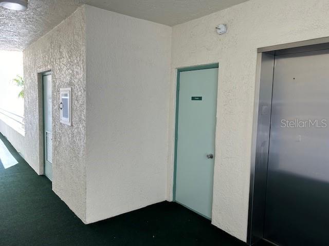 7979 Sailboat Key Blvd S Unit 505, South Pasadena, FL 33707 - entrance to property featuring stucco siding and elevator