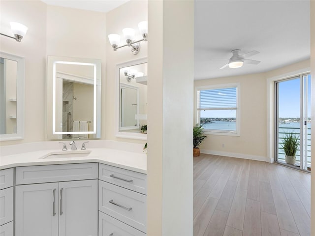 7979 Sailboat Key Blvd S Unit 505, South Pasadena, FL 33707 - bathroom with vanity, wood finished floors, and a ceiling fan