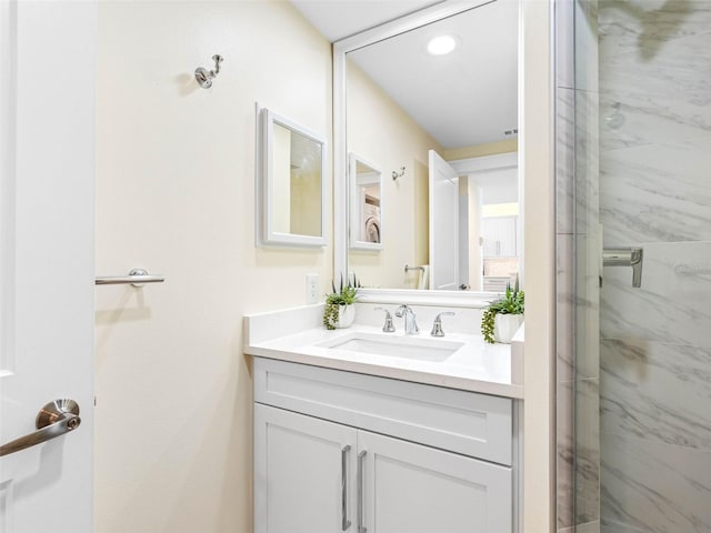 7979 Sailboat Key Blvd S Unit 505, South Pasadena, FL 33707 - bathroom with a marble finish shower, vanity, and recessed lighting