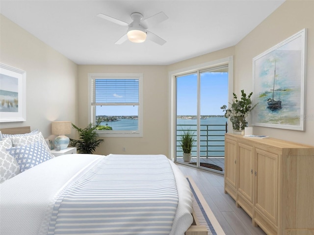 7979 Sailboat Key Blvd S Unit 505, South Pasadena, FL 33707 - bedroom with access to outside, light wood-style flooring, and ceiling fan