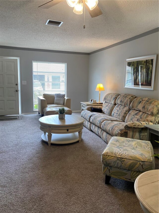 832 Cambridge Ct, Dunedin, FL 34698 - carpeted living area featuring a textured ceiling and ceiling fan
