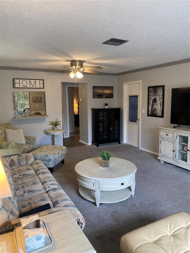 832 Cambridge Ct, Dunedin, FL 34698 - carpeted living area with a textured ceiling and a ceiling fan