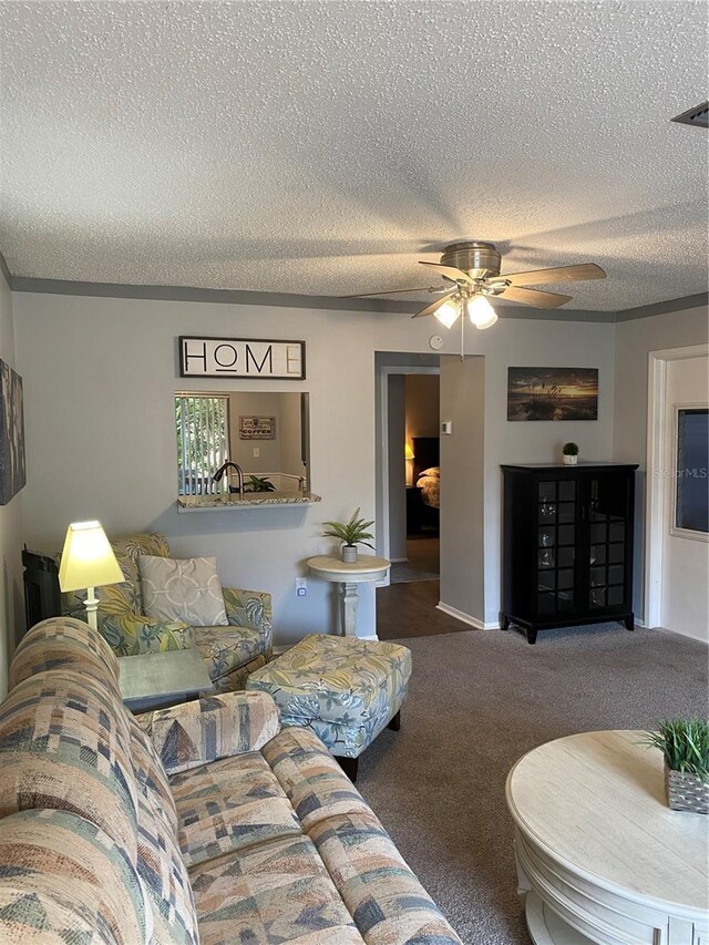 832 Cambridge Ct, Dunedin, FL 34698 - living room with a textured ceiling, carpet flooring, and a ceiling fan