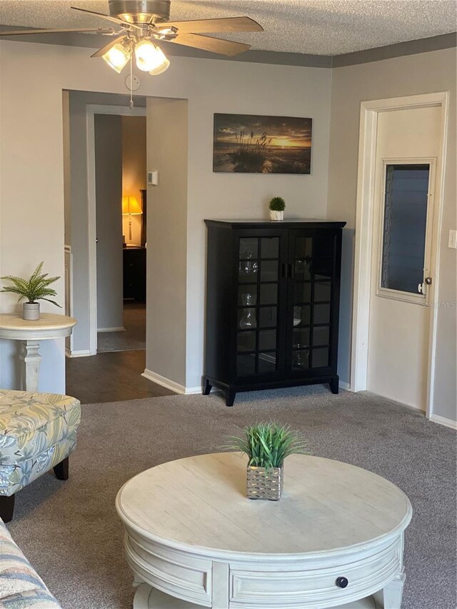 832 Cambridge Ct, Dunedin, FL 34698 - carpeted living room featuring ceiling fan and baseboards