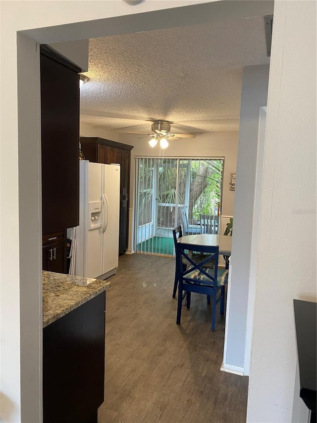 832 Cambridge Ct, Dunedin, FL 34698 - dining area featuring ceiling fan, dark wood-style floors, and a textured ceiling