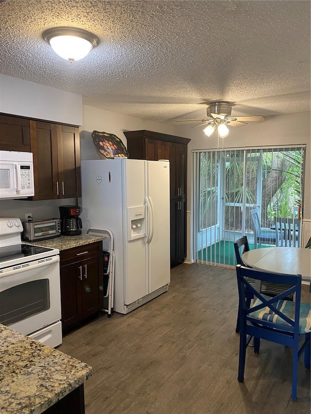 832 Cambridge Ct, Dunedin, FL 34698 - kitchen featuring white appliances, a textured ceiling, dark brown cabinetry, a ceiling fan, and wood finished floors