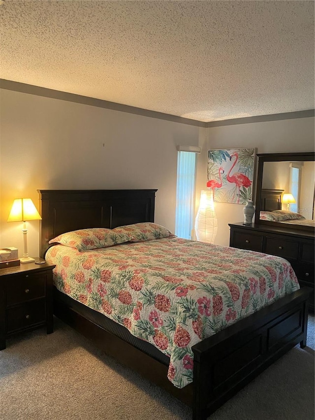 832 Cambridge Ct, Dunedin, FL 34698 - bedroom with a textured ceiling and light carpet