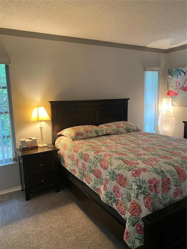 832 Cambridge Ct, Dunedin, FL 34698 - bedroom with light colored carpet and a textured ceiling