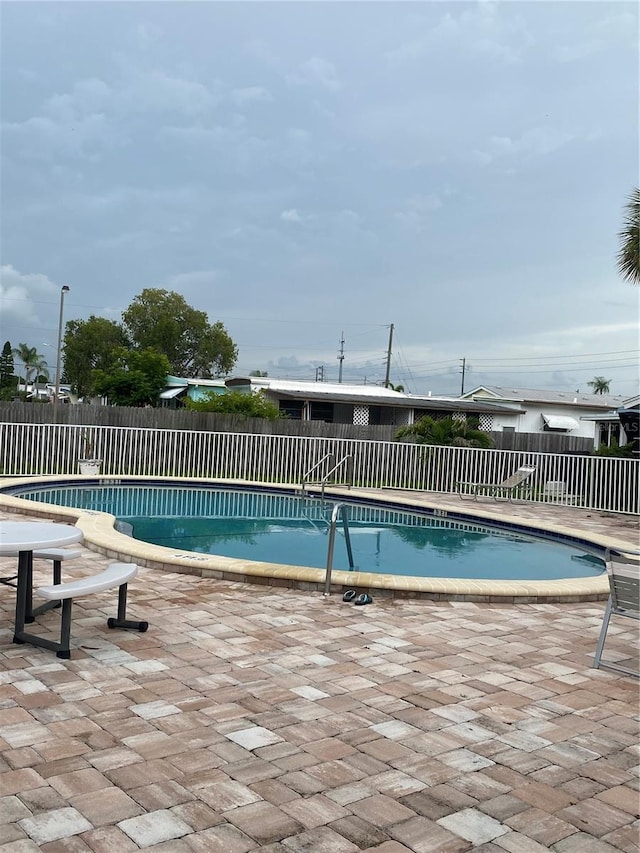 832 Cambridge Ct, Dunedin, FL 34698 - community pool with a patio area