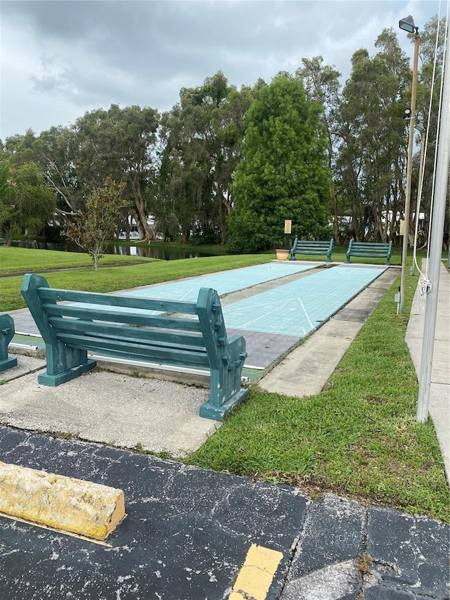 832 Cambridge Ct, Dunedin, FL 34698 - view of community with shuffleboard and a yard