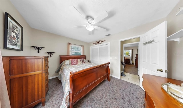 1753 Ranchette Rd, Wesley Chapel, FL 33543 - bedroom featuring light carpet, a closet, ceiling fan, and light tile patterned flooring