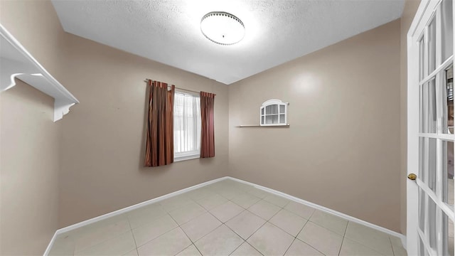 1753 Ranchette Rd, Wesley Chapel, FL 33543 - unfurnished room featuring a textured ceiling and light tile patterned flooring