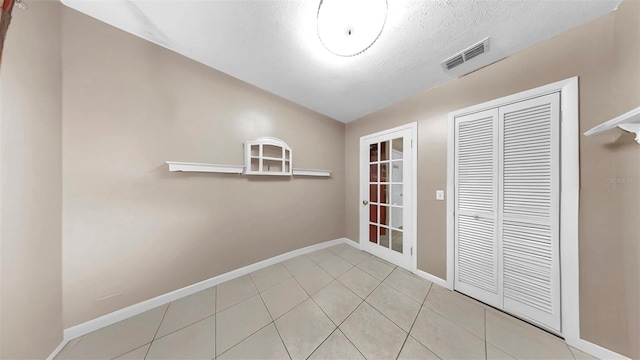 1753 Ranchette Rd, Wesley Chapel, FL 33543 - unfurnished dining area featuring tile patterned flooring and a textured ceiling