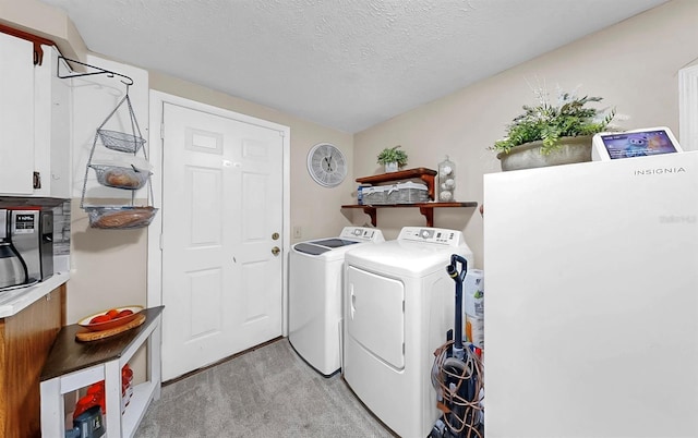 1753 Ranchette Rd, Wesley Chapel, FL 33543 - laundry area featuring washer and dryer, light colored carpet, and a textured ceiling