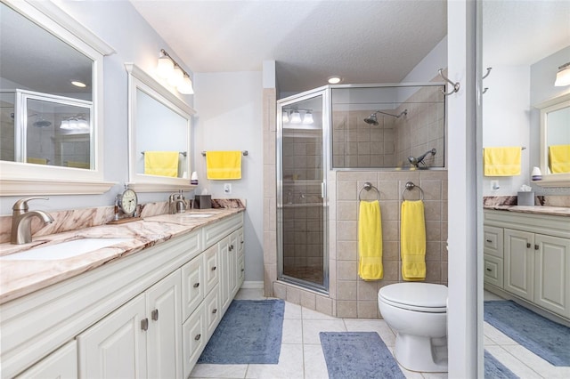 1626 Terra Ceia Bay Cir Unit 1626, Palmetto, FL 34221 - full bath with double vanity, tile patterned flooring, a stall shower, recessed lighting, and a textured ceiling