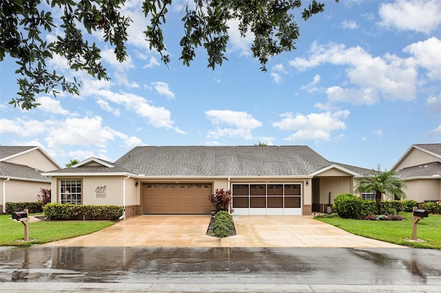 1626 Terra Ceia Bay Cir Unit 1626, Palmetto, FL 34221 - single story home with an attached garage, stucco siding, a front yard, driveway, and roof with shingles