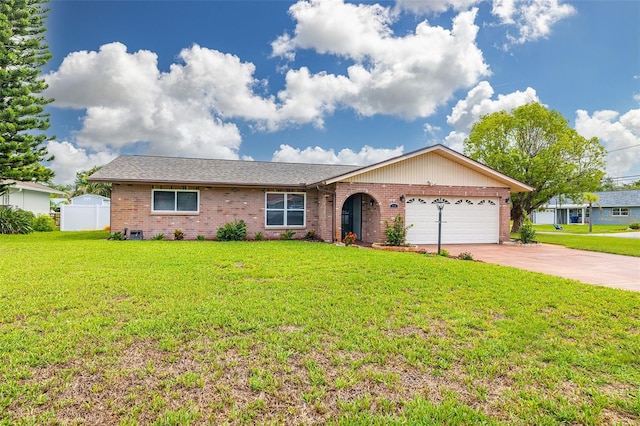 314 Circle Dr, Palm Harbor, FL 34683 - ranch-style house with brick siding, an attached garage, and concrete driveway