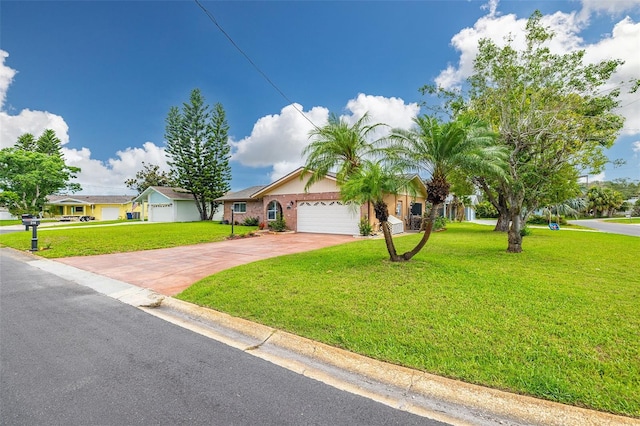 314 Circle Dr, Palm Harbor, FL 34683 - ranch-style house with a front yard, driveway, and an attached garage