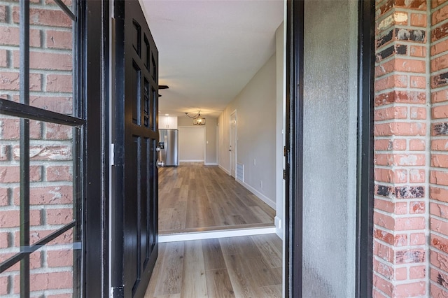 314 Circle Dr, Palm Harbor, FL 34683 - hall featuring wood finished floors and baseboards