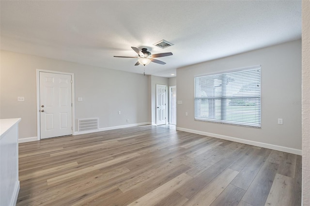 314 Circle Dr, Palm Harbor, FL 34683 - spare room featuring a ceiling fan and light wood-style floors