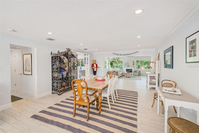 1578 Druid Rd S, Belleair, FL 33756 - dining space with crown molding and recessed lighting