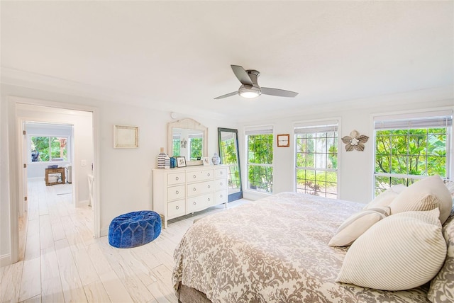 1578 Druid Rd S, Belleair, FL 33756 - bedroom with multiple windows and a ceiling fan
