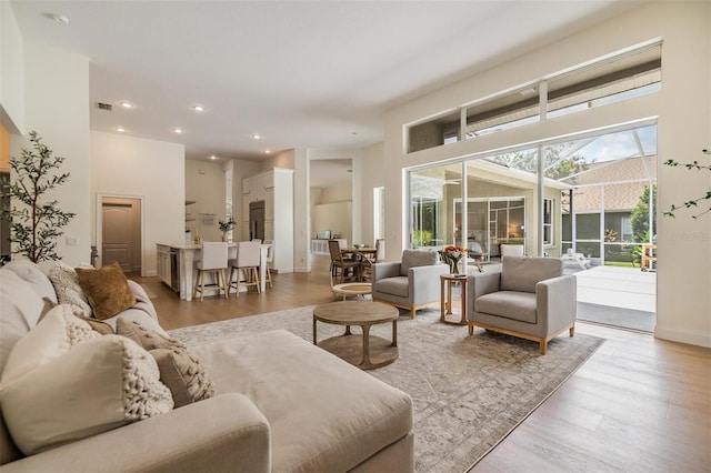 9126 Cypress Keep Ln, Odessa, FL 33556 - living area featuring wood finished floors and recessed lighting