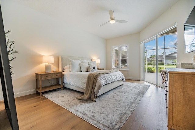 9126 Cypress Keep Ln, Odessa, FL 33556 - bedroom featuring access to exterior, light wood-type flooring, and ceiling fan