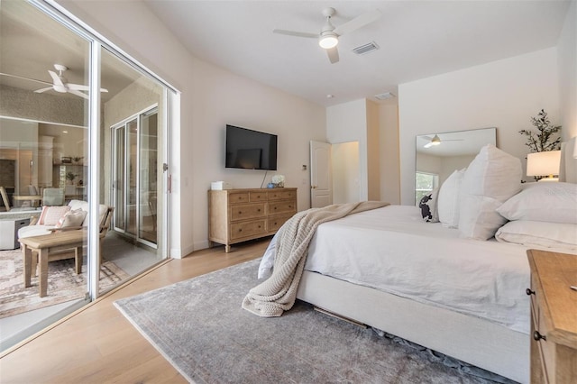 9126 Cypress Keep Ln, Odessa, FL 33556 - bedroom with wood finished floors, ceiling fan, and access to exterior
