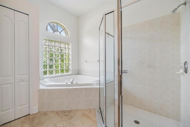 9126 Cypress Keep Ln, Odessa, FL 33556 - bathroom featuring a shower stall, healthy amount of natural light, a bath, and a closet