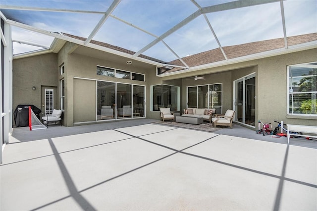 9126 Cypress Keep Ln, Odessa, FL 33556 - back of house with outdoor lounge area, stucco siding, a patio area, and ceiling fan